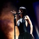 María Zardoya singing under warm lights at Shaky Knees 2025 Day 1 – concert photo by Greeblehaus.com