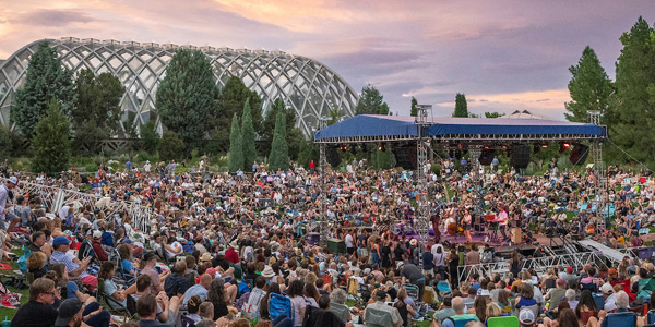 Denver Botanic Gardens Summer Concert Series 2026 at York Street in Denver with outdoor stage and seated crowd at sunset