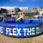 Photos from Day 1 of Outside Days 2026 at Auraria Campus in Denver featuring bands, festivalgoers, and outdoor installations.