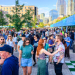 Photos from Day 1 of Outside Days 2026 at Auraria Campus in Denver featuring bands, festivalgoers, and outdoor installations.