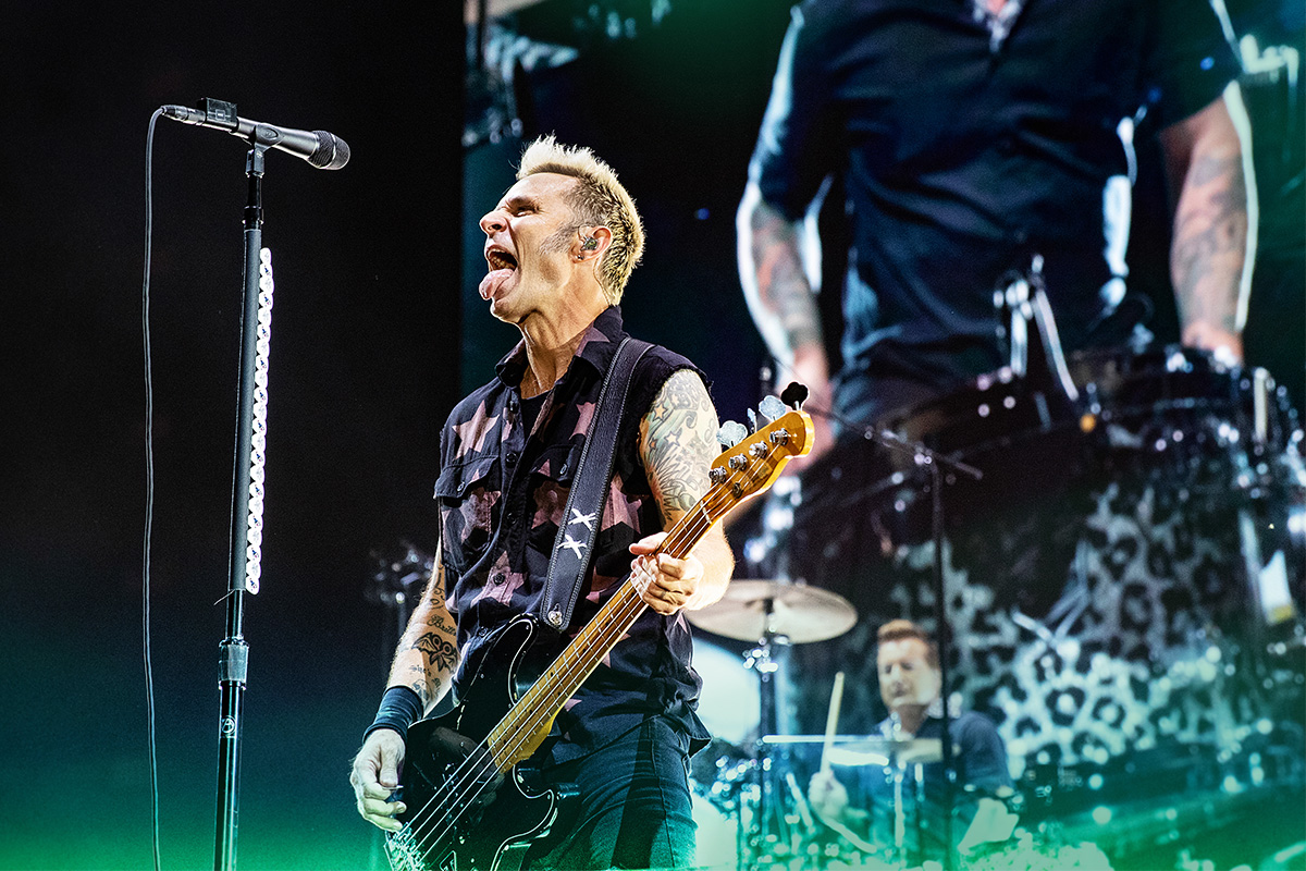 Mike Dirnt performs with Green Day in concert.